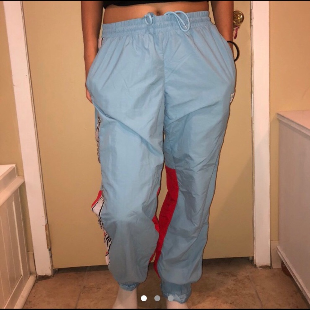REEBOK BLUE RED AND WHITE WINDBREAKER PANTS
